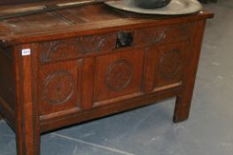 A GOOD EARLY 18TH.C.OAK CARVED PANEL FRONT COFFER