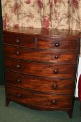 A VICTORIAN MAHOGANY TALL BOW FRONT CHEST OF TWO SHORT AND FOUR LONG DRAWERS