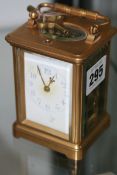 A SMALL LATE VICTORIAN GILT BRASS CASED CARRIAGE CLOCK WITH STRIKE REPEAT