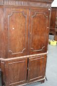 A GEORGIAN MAHOGANY FLOOR STANDING FOUR DOOR CORNER CABINET