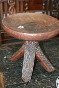A CARVED AFRICAN STOOL