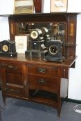 AN ARTS AND CRAFTS OAK MIRROR BACK SIDE CABINET