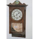 A SMALL VICTORIAN STRIKING WALL CLOCK TOGETHER WITH A CAST IRON CASED STRIKING CLOCK WITH BAROMETER