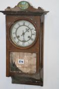 A SMALL VICTORIAN STRIKING WALL CLOCK TOGETHER WITH A CAST IRON CASED STRIKING CLOCK WITH BAROMETER