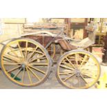 A 19TH CENTURY FOUR WHEEL CARRIAGE OR SURREY- BARN STORED CONDITION BUT SOUND
