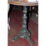 A VICTORIAN CAST IRON BASED GARDEN TABLE