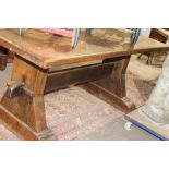 AN UNUSUAL OAK REFECTORY TABLE OF STURDY CONSTRUCTION