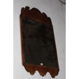 A GEORGIAN MAHOGANY WALL MIRROR WITH SHAPED PEDIMENT