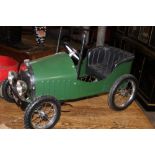 A VETERAN STYLE TIN PLATE PEDAL CAR