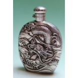 An oriental silver coloured spirit flask with embossed dragon decoration, bears character marks,