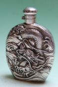 An oriental silver coloured spirit flask with embossed dragon decoration, bears character marks,