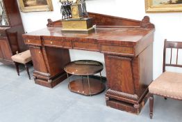 A William IV mahogany sideboard, with four frieze drawers over fitted pedestal cabinets, 214cm wide