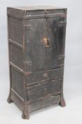 An interesting antique Japanese provincial lacquered and iron bound small cabinet, possibly a