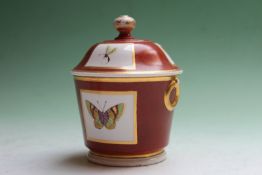 A 19th Century sucrier with cover, the brick red field painted with individual butterflies, possibly