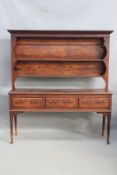 An 18th Century oak dresser and rack, with moulded cornice over shelved plate rack, on three