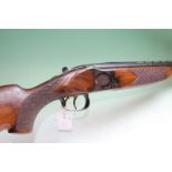 A Winchester 101 double barrelled 12bore over and under shotgun, 30inch barrels, border and scroll