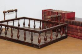 A Regency rosewood book carrier, with pierced spindle gallery, 31cm wide