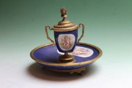A late 19th Century French encrier with gilt metal mounts and bleu de Roi ground, hand painted