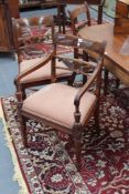 A set of six 19th Century mahogany dining chairs, with scrolled back splats, turned legs, cross