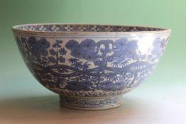 A Chinese blue and white bowl, the interior with cranes near water, the exterior with trailing