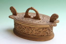 An integral carved and gilded oval two handle box with conforming lid, possibly Scandinavian, 30cm