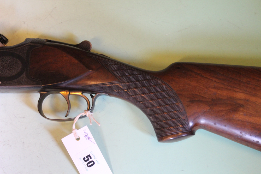 A Laurona 12-bore over and under shotgun, 26inch barrels, border and scroll engraved double - Image 4 of 11