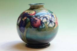 A Moorcroft pottery baluster vase, with orchid decoration, impressed marks, 10cm high