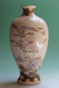 A Japanese Satsuma baluster vase decorated with flowers and butterflies, bears character mark to