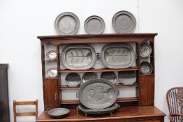 A group of 18th/19th Century pewter plates, to include four large warming plates, other serving