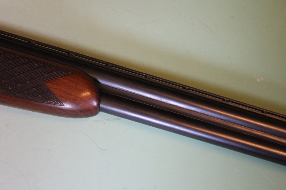 A Laurona 12-bore over and under shotgun, 26inch barrels, border and scroll engraved double - Image 10 of 11