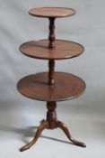 A 19th Century mahogany three tier dumb waiter, the graduated raised edge circular platforms with