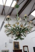 A pair of Continental polychrome tole six light "lily" chandeliers, 60cm high x 55cm diameter