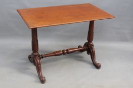 A mid Victorian mahogany centre table, on carved turned supports and swept legs united by a