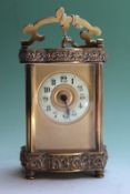 A late 19th Century French eight day carriage clock, with embossed borders, 12cm high