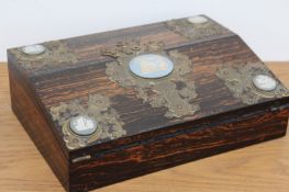 A Victorian coromandel writing box, the applied gilt brass mount inset with Jasper ware plaques,