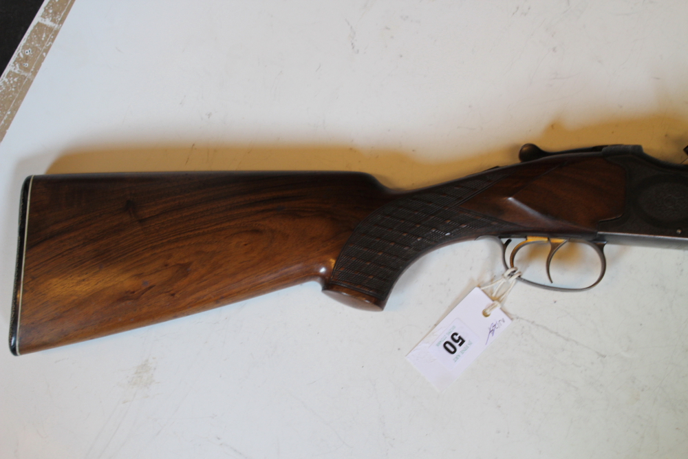 A Laurona 12-bore over and under shotgun, 26inch barrels, border and scroll engraved double - Image 8 of 11