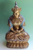 A Chinese ceramic figure of a Bodhisattva, with intricate gilded decoration and robin's egg coloured
