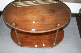 A 19th Century campaign washstand, with oval teak tiers, brass galleried top and conforming