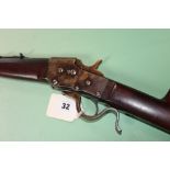 A Bullard tipping block underlever single shot rifle in .22 hornet, serial number 2215. (st no.