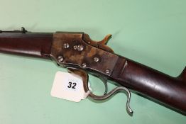 A Bullard tipping block underlever single shot rifle in .22 hornet, serial number 2215. (st no.