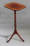 A Regency mahogany and boxwood banded tilt top lamp or wine table, the octagonal top over slender