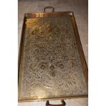 Keswick School of Industrial Arts: a brass twin handled tray with Eastern style decoration over all,