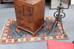 An Oriental rug of Caucasian design and a Persian rug with animal motifs, 148 x 103cm