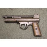 An Early Webley air pistol Mark 1 .177 calibre with long barrel and wood grips inset with flying