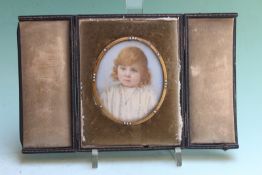 An Edwardian oval miniature portrait of a young girl, signed Viva K Hobson, 7 x 6cm, cased