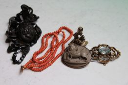 A Victorian vulcanite memorial locket on chain link necklace, a child's coral necklace, a lava cameo