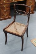 A set of eight Regency mahogany dining chairs, each with rope twist top rail above X form cross