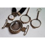 A Victorian gilded oval memorial clasp set with hair, two quizzing glasses, and a bracelet set