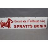 A large enamel advertising sign in red script - Spratts Bonio "The sure way of "building up" a