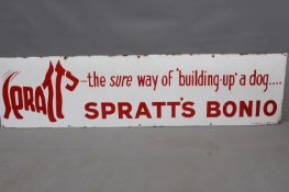 A large enamel advertising sign in red script - Spratts Bonio "The sure way of "building up" a